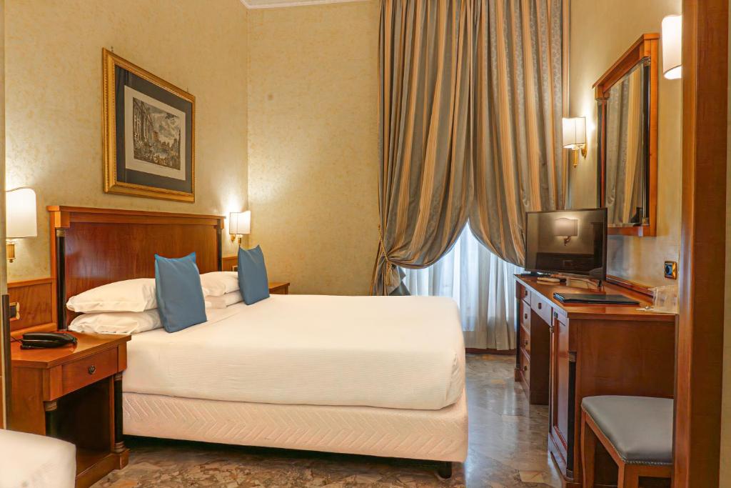 Postel nebo postele na pokoji v ubytování Hotel Miami