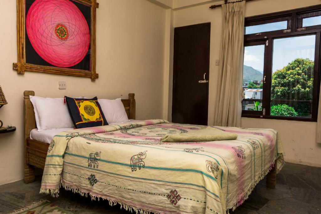 Letto o letti in una camera di Peace Eye Guest House