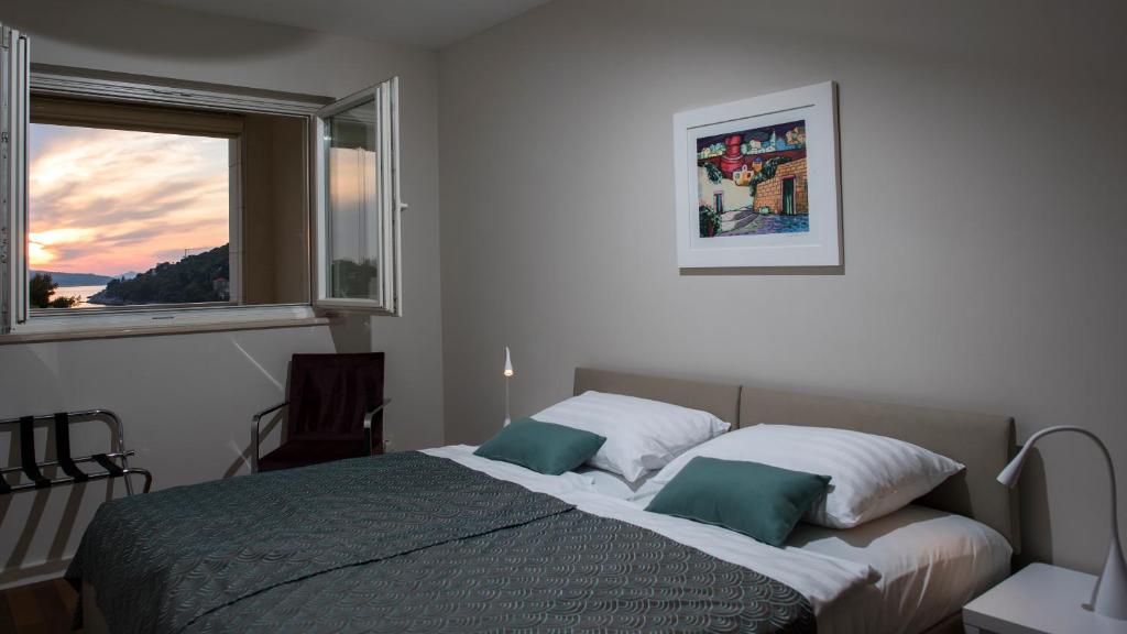 Postel nebo postele na pokoji v ubytování Flowers Dubrovnik Luxury Apartments