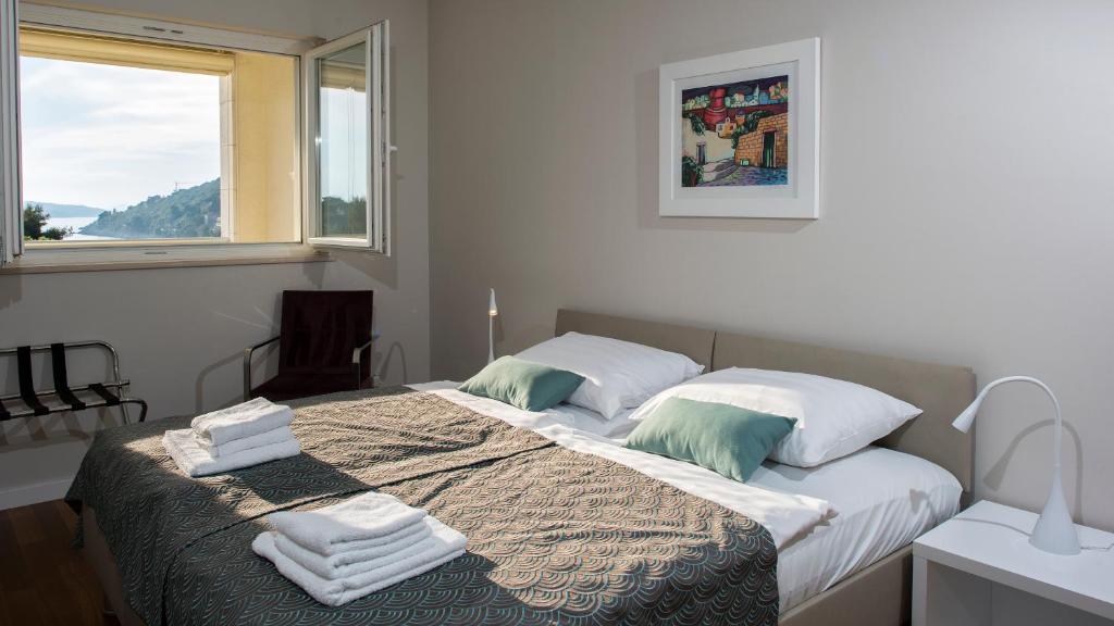 Postel nebo postele na pokoji v ubytování Flowers Dubrovnik Luxury Apartments