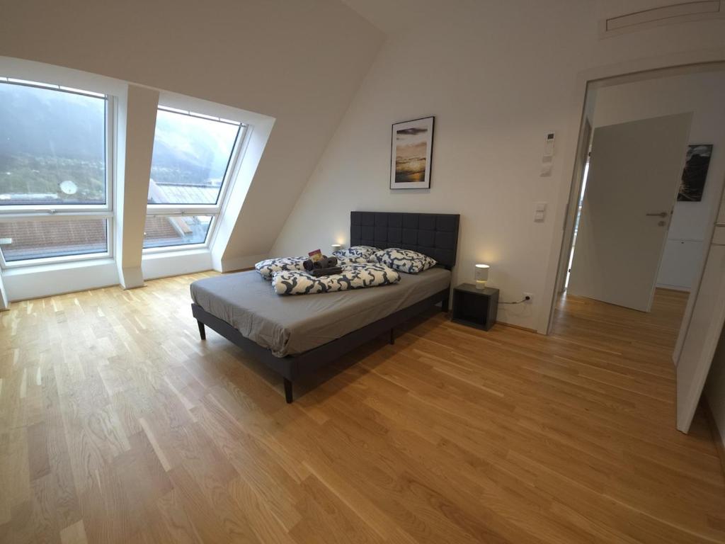 En eller flere senge i et værelse på Innsbruck Downtown Heaven Apartment