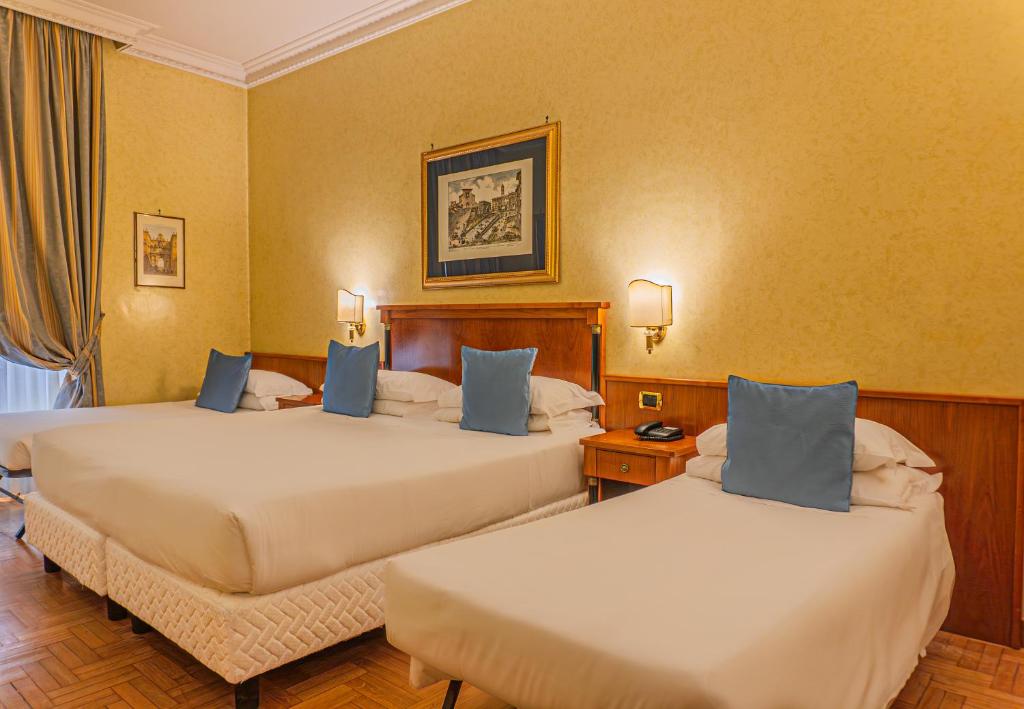 Postel nebo postele na pokoji v ubytování Hotel Miami