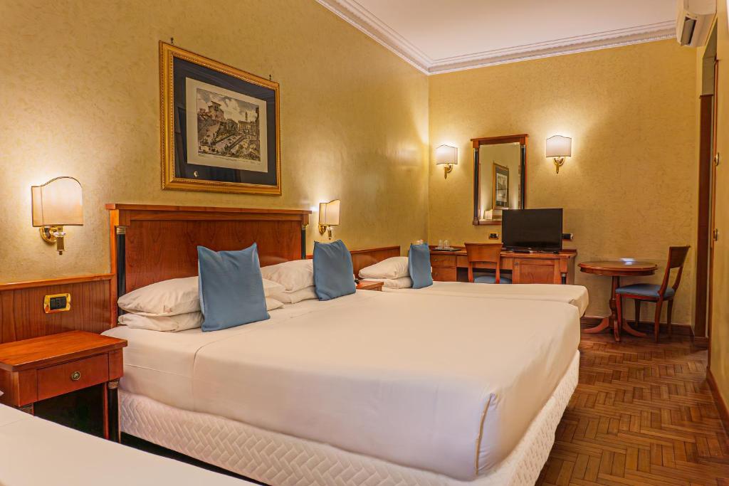 Postel nebo postele na pokoji v ubytování Hotel Miami