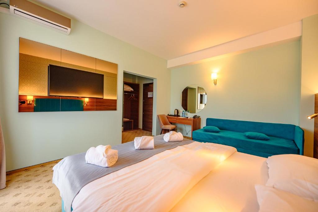 Postel nebo postele na pokoji v ubytování Hotel Ryon