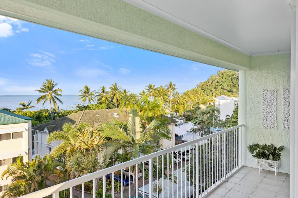 a balcony with a view of the ocean at Palm & Sea Trinity Beach in Trinity Beach
