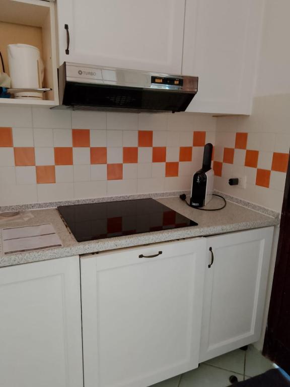 Kuchyň nebo kuchyňský kout v ubytování Residence Cala Rossa