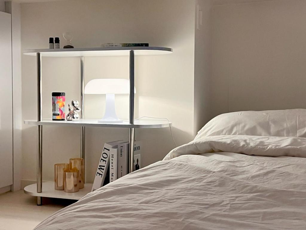 a bedroom with a bed and a book shelf at Healing House in Seoul