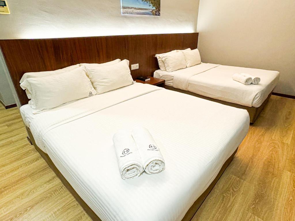 Postel nebo postele na pokoji v ubytování Emart Hotel (Riam)