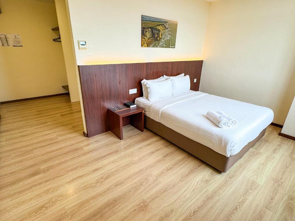 Postel nebo postele na pokoji v ubytování Emart Hotel (Riam)