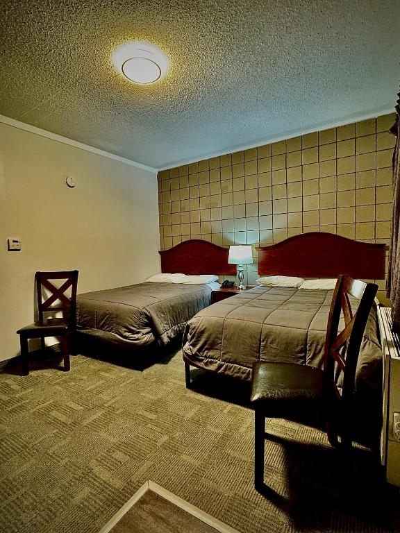 Postel nebo postele na pokoji v ubytování Caravel Motel