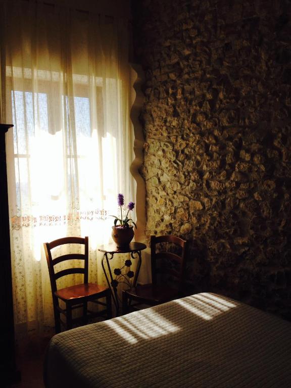 Postel nebo postele na pokoji v ubytování Locanda dell'Arcangelo