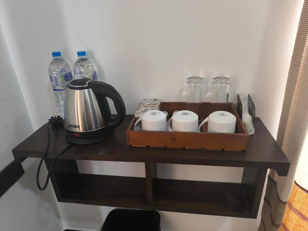 Příslušenství pro přípravu čaje a kávy v ubytování The Residence by Amaya