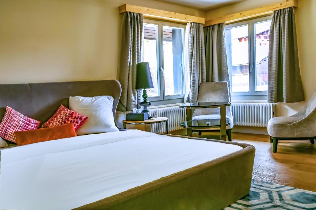 Postel nebo postele na pokoji v ubytování Hotel Lakeview bei Interlaken