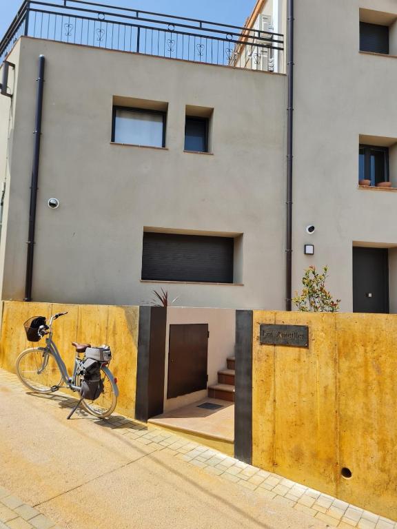 a bike parked in front of a building at Les Ametlles in Masarach
