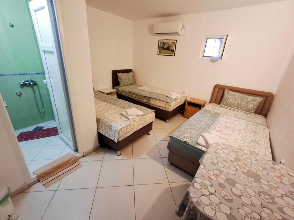 Postel nebo postele na pokoji v ubytování AS MONTENEGRO SUITES