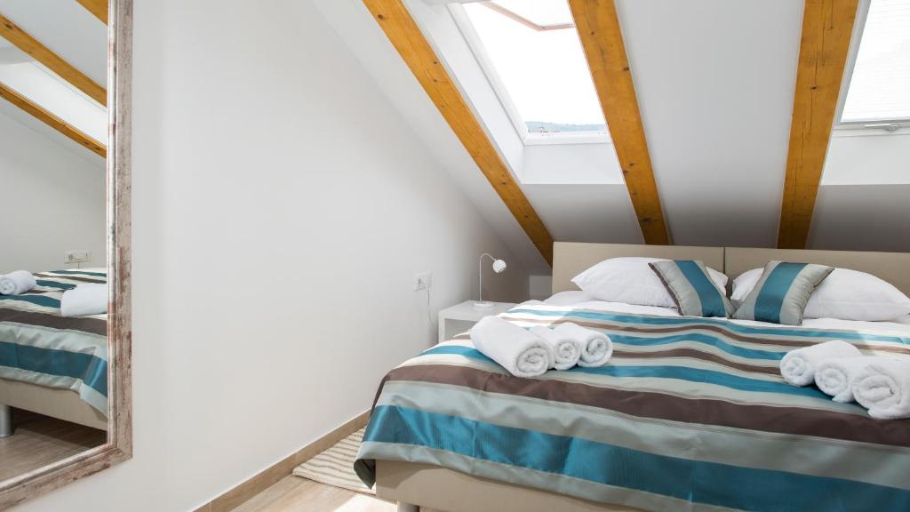 Postel nebo postele na pokoji v ubytování Flowers Dubrovnik Luxury Apartments