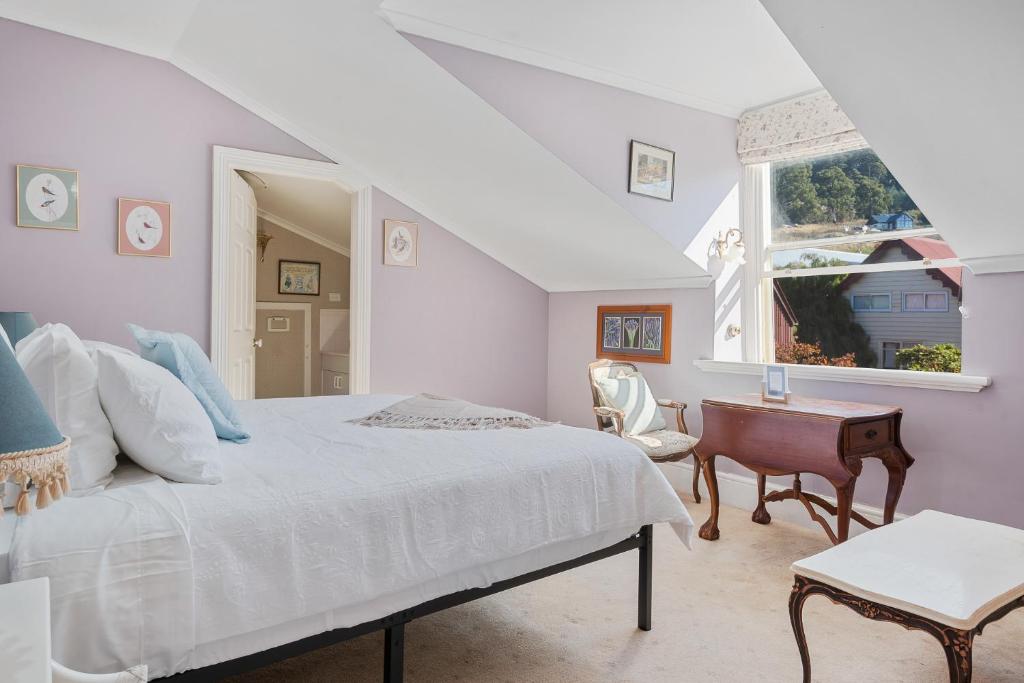 a white bedroom with a bed and a window at Franklin Lodge, Huon Valley, Tasmania, Lavender Room in Franklin