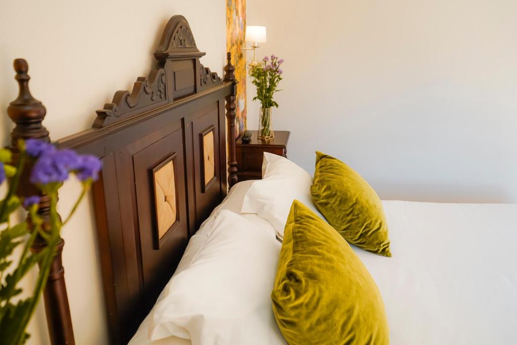 Postel nebo postele na pokoji v ubytování Hotel Rosaleda Don Pedro