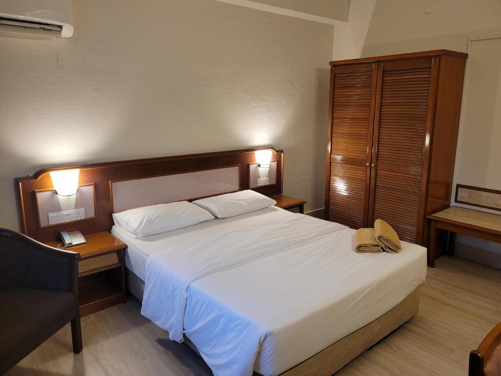 Postel nebo postele na pokoji v ubytování Somerset Hotel