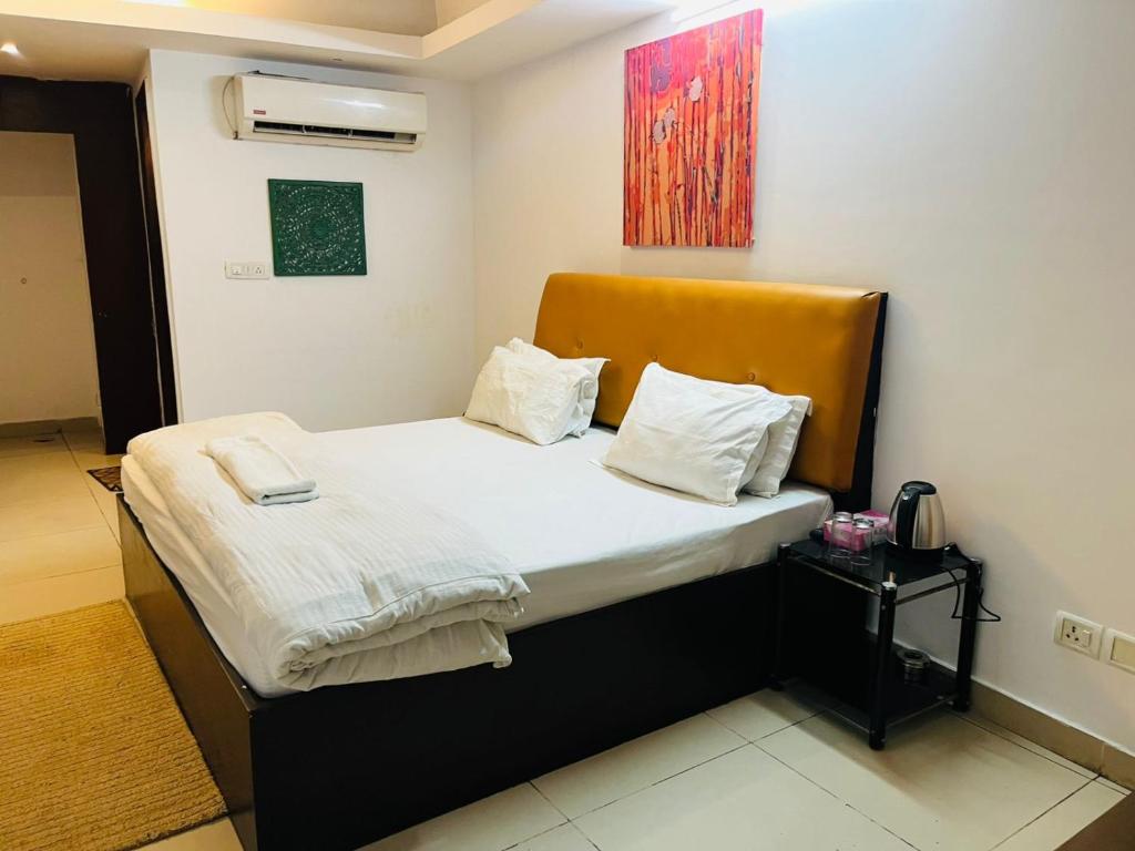 Postel nebo postele na pokoji v ubytování Hotel C 5 Hauz Khas