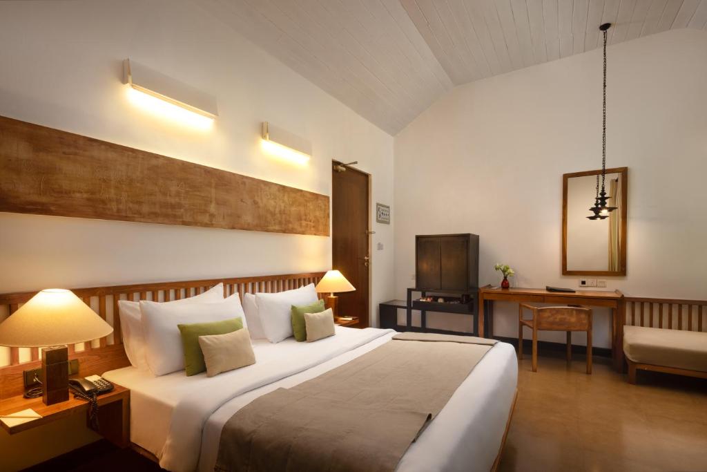 Postel nebo postele na pokoji v ubytování SigiriyaJungles Resort & Spa