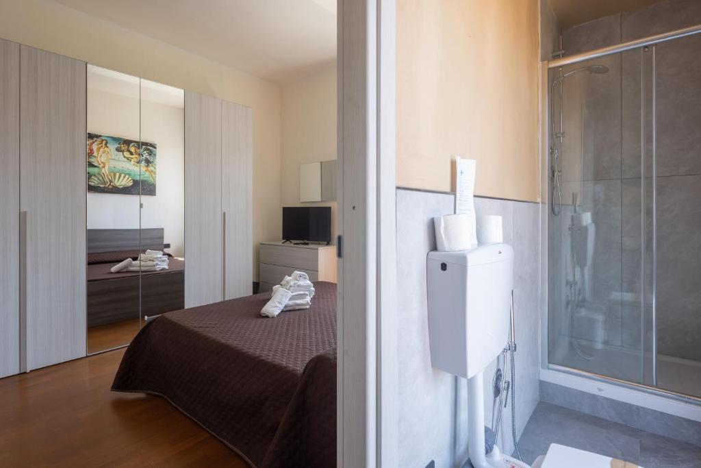 Postel nebo postele na pokoji v ubytování Il Cinquecento Suites