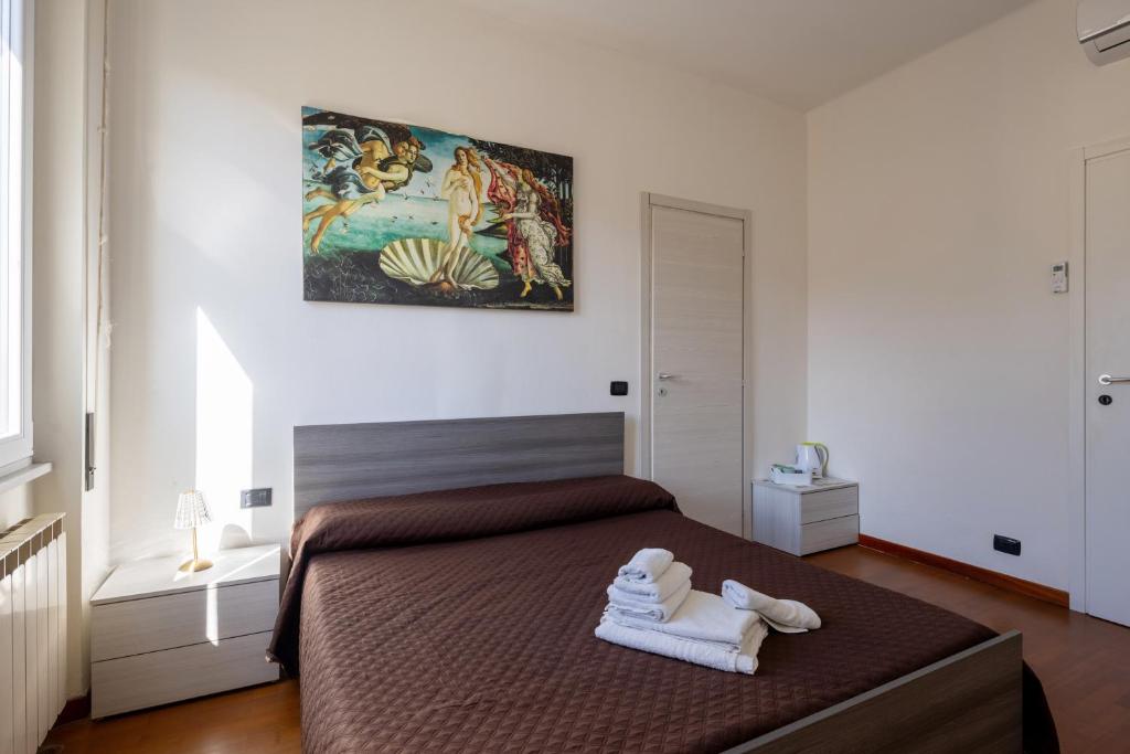 Postel nebo postele na pokoji v ubytování Il Cinquecento Suites