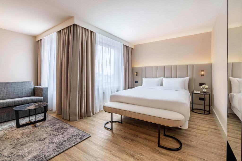 Postel nebo postele na pokoji v ubytování NH Amsterdam Leidseplein