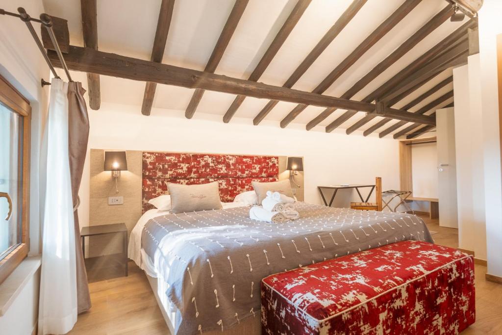 Postel nebo postele na pokoji v ubytování Agriturismo Rascioni & Cecconello