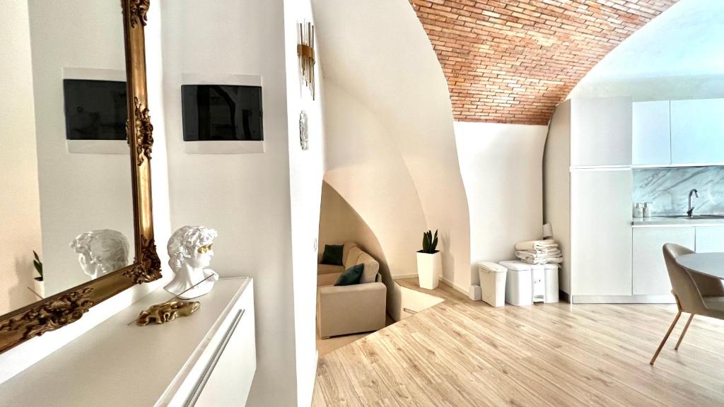 TV a/nebo společenská místnost v ubytování L'Arco sul Lago - Deluxe Apartment