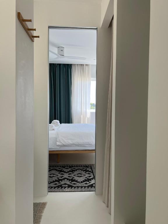 Postel nebo postele na pokoji v ubytování Sol MELBA Boutique Studios - Maslinica