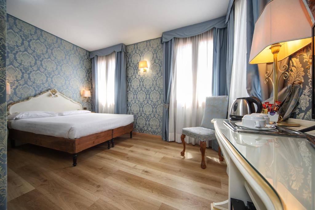 Posteľ alebo postele v izbe v ubytovaní Locanda Antica Venezia
