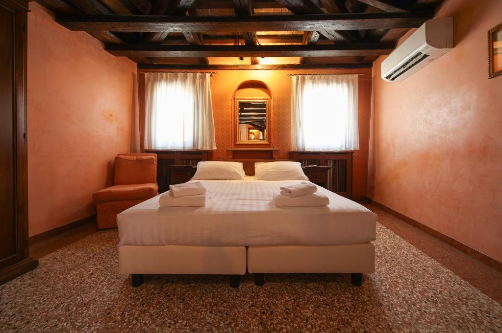 Posteľ alebo postele v izbe v ubytovaní Locanda Antica Venezia