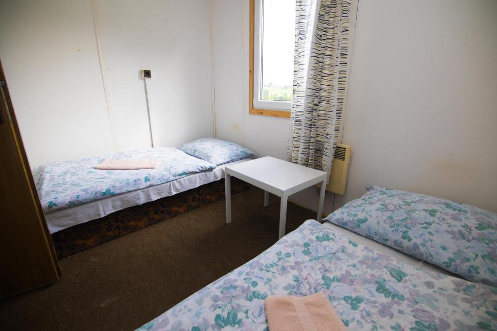 Postel nebo postele na pokoji v ubytování Chata Centrum Pastvinská přehrada