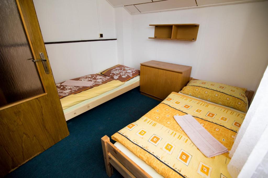 Postel nebo postele na pokoji v ubytování Chata Centrum Pastvinská přehrada