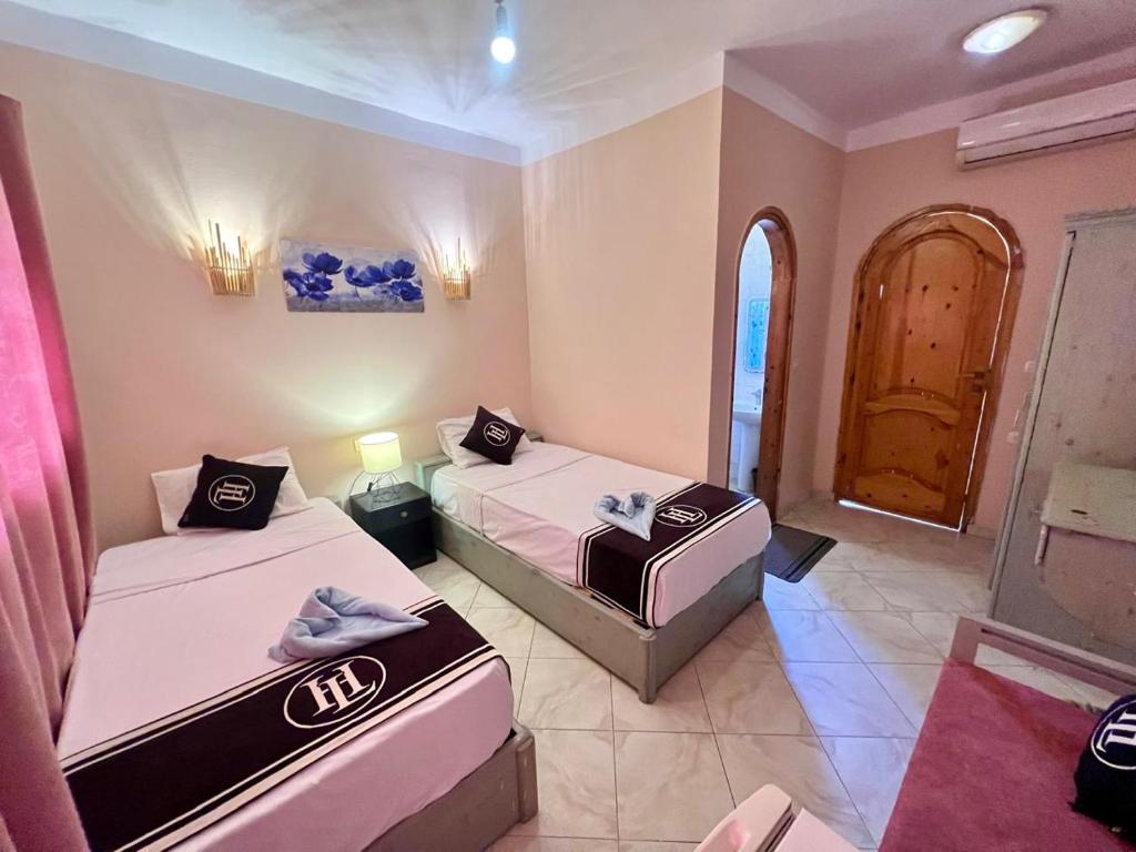 Postel nebo postele na pokoji v ubytování Happy Land Hotel Dahab