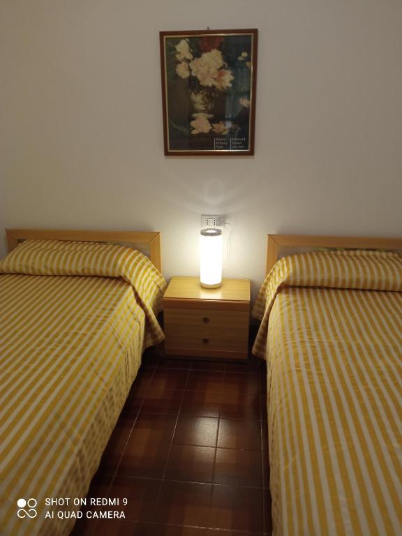 Postel nebo postele na pokoji v ubytování Appartamento al mare