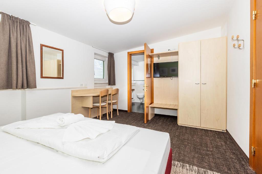 Postel nebo postele na pokoji v ubytování Hotel Heide Park