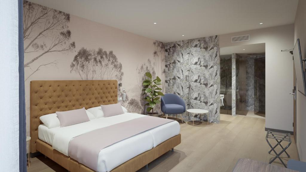 a bedroom with a white bed and a blue chair at ASA Molina Plaza in Molina de Segura