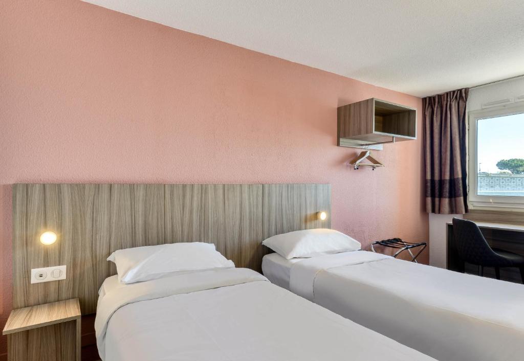 Postel nebo postele na pokoji v ubytování B&B HOTEL Sète Centre Gare