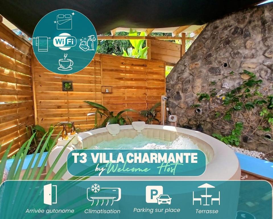 Un cartel delante de un centro de bienestar con jacuzzi. en Villa Charmante, Détente, Jacuzzi aux Avirons, en Les Avirons