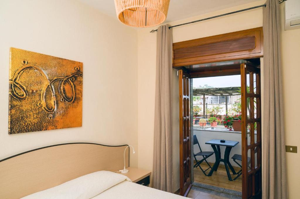 Postel nebo postele na pokoji v ubytování Casa Di Meglio Dependance