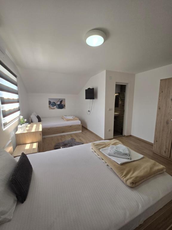 Postel nebo postele na pokoji v ubytování Villa Boho Cherga