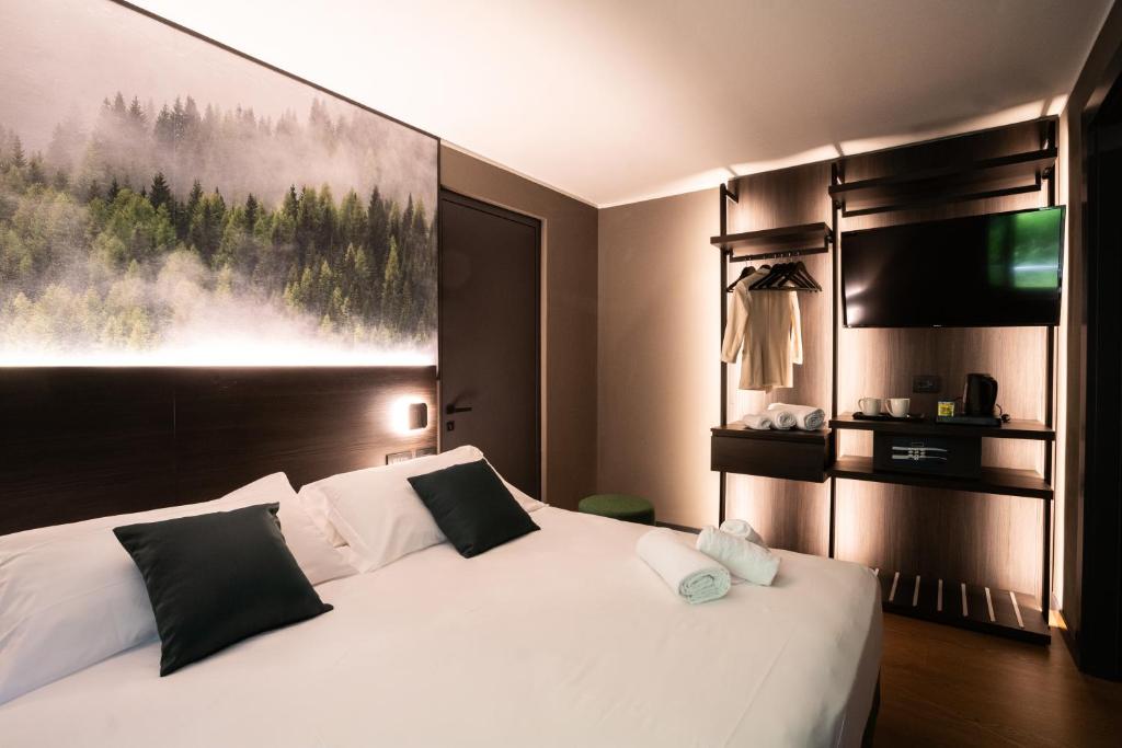 Postel nebo postele na pokoji v ubytování Hotel Due Cime