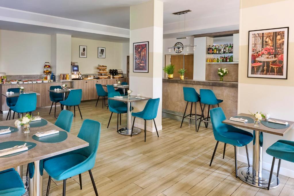 Restaurant ou autre lieu de restauration dans l'établissement Fraser Suites Paris La Défense