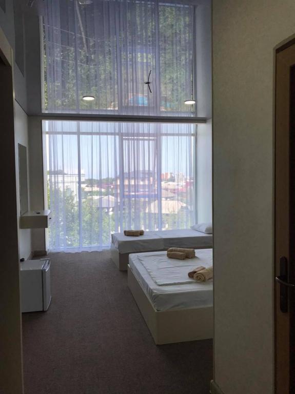 Postel nebo postele na pokoji v ubytování Comfortium