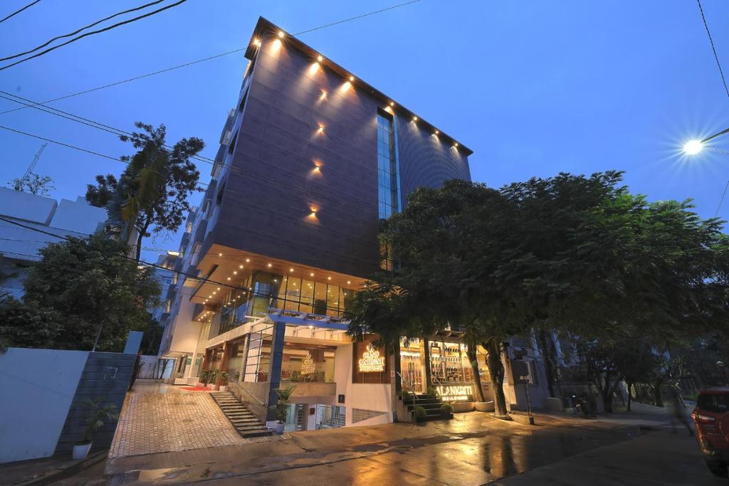 a building with lights on the side of it at Hotel Grand Continent Premiere, Banjara Hills, Hyderabad in Hyderabad