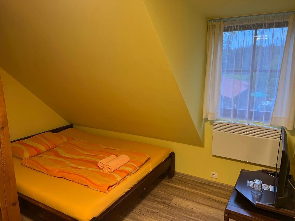 Postel nebo postele na pokoji v ubytování Penzion Kaminek