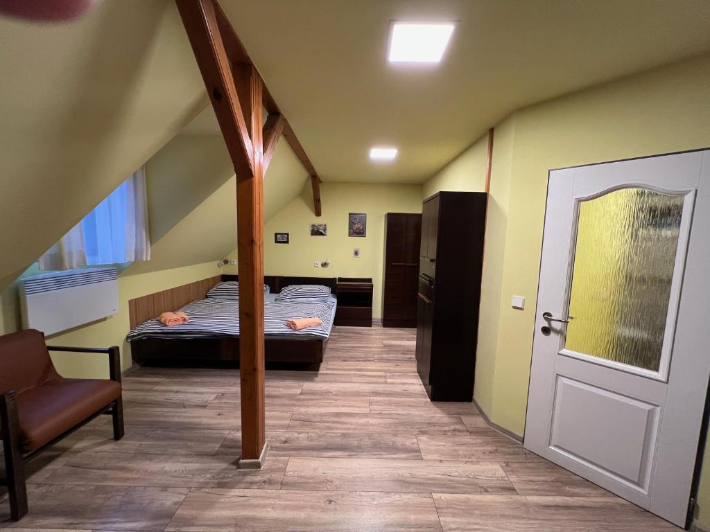 Postel nebo postele na pokoji v ubytování Penzion Kaminek