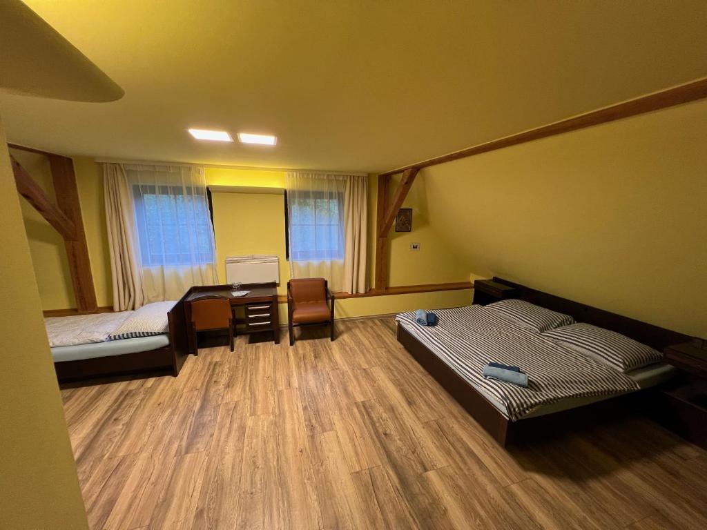 Postel nebo postele na pokoji v ubytování Penzion Kaminek